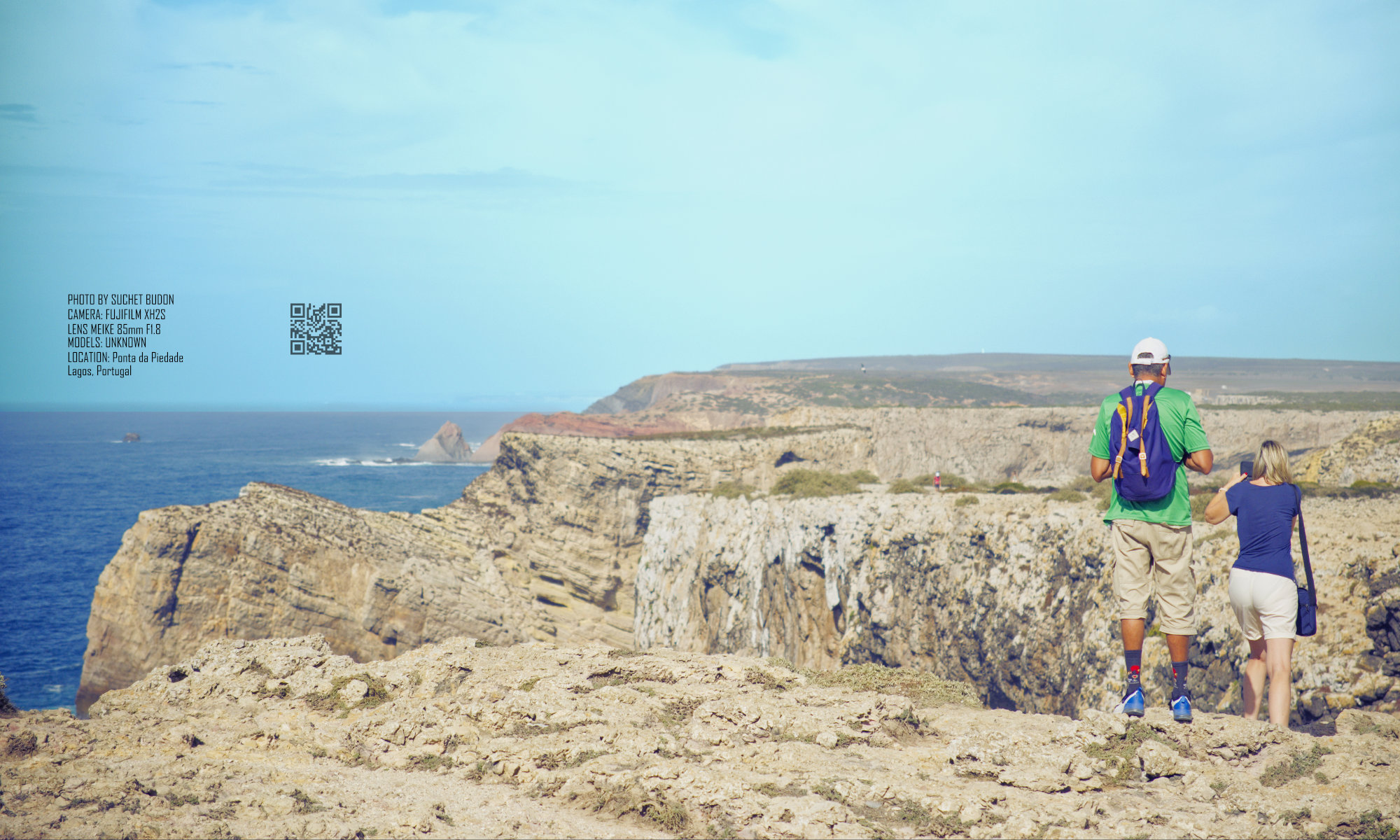 A couple of unknown photographers on the clifftops in Lagos, Portugal.